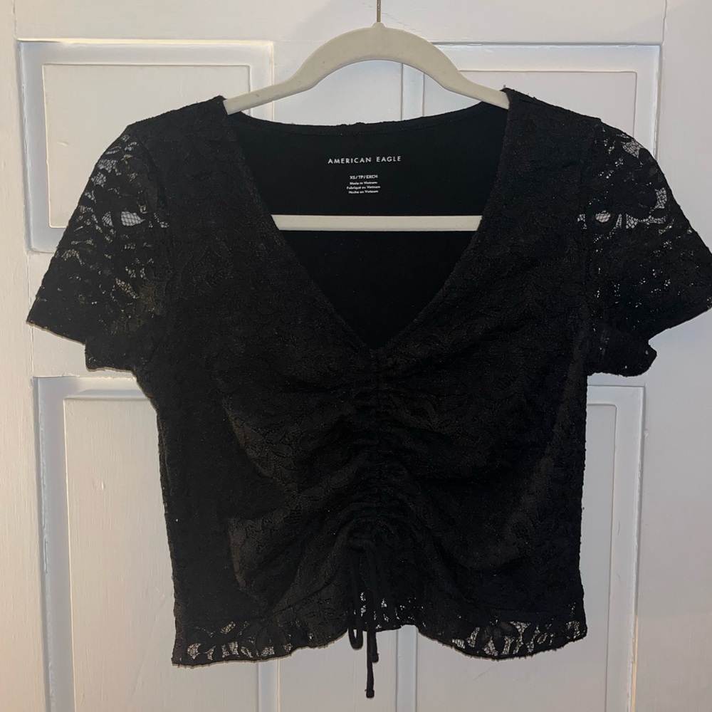 Women’s American Eagle short sleeve top. Size: XS. Black, V-neck, lace.